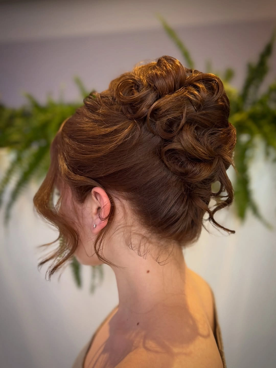 Fall hairstyles for wedding guests 2026 Textured Romantic Updo with Sculpted Volume