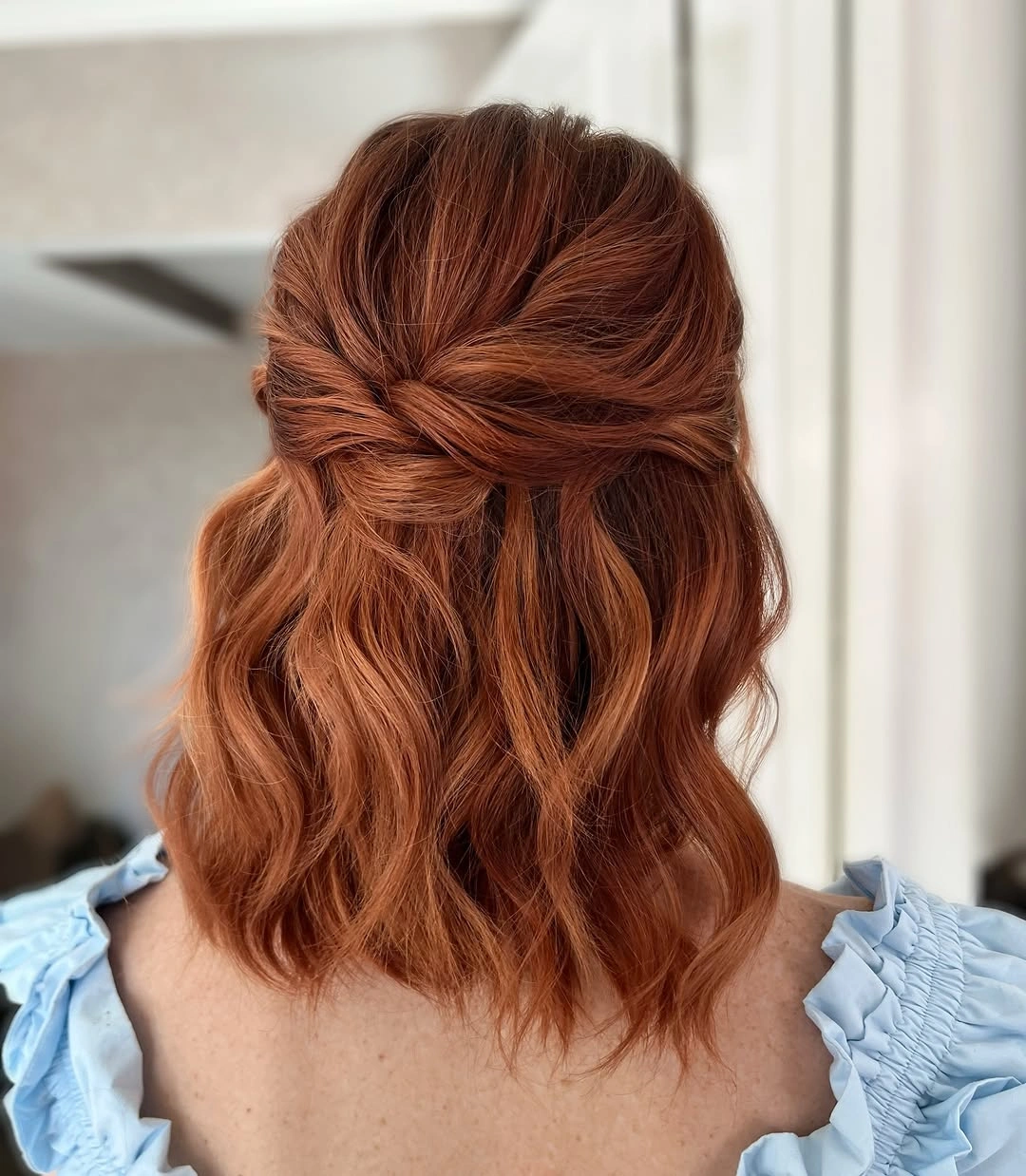 Fall hairstyles for wedding guests 2026 Soft Copper Half-Up Waves for Shorter Lengths
