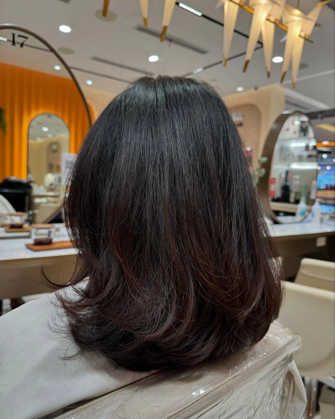 fall medium haircuts 2026 Layered Blowout with Curved Ends