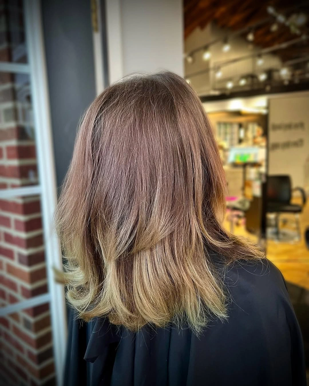 fall medium haircuts 2026 Soft Flicked Layers with Natural Mushroom Brunette