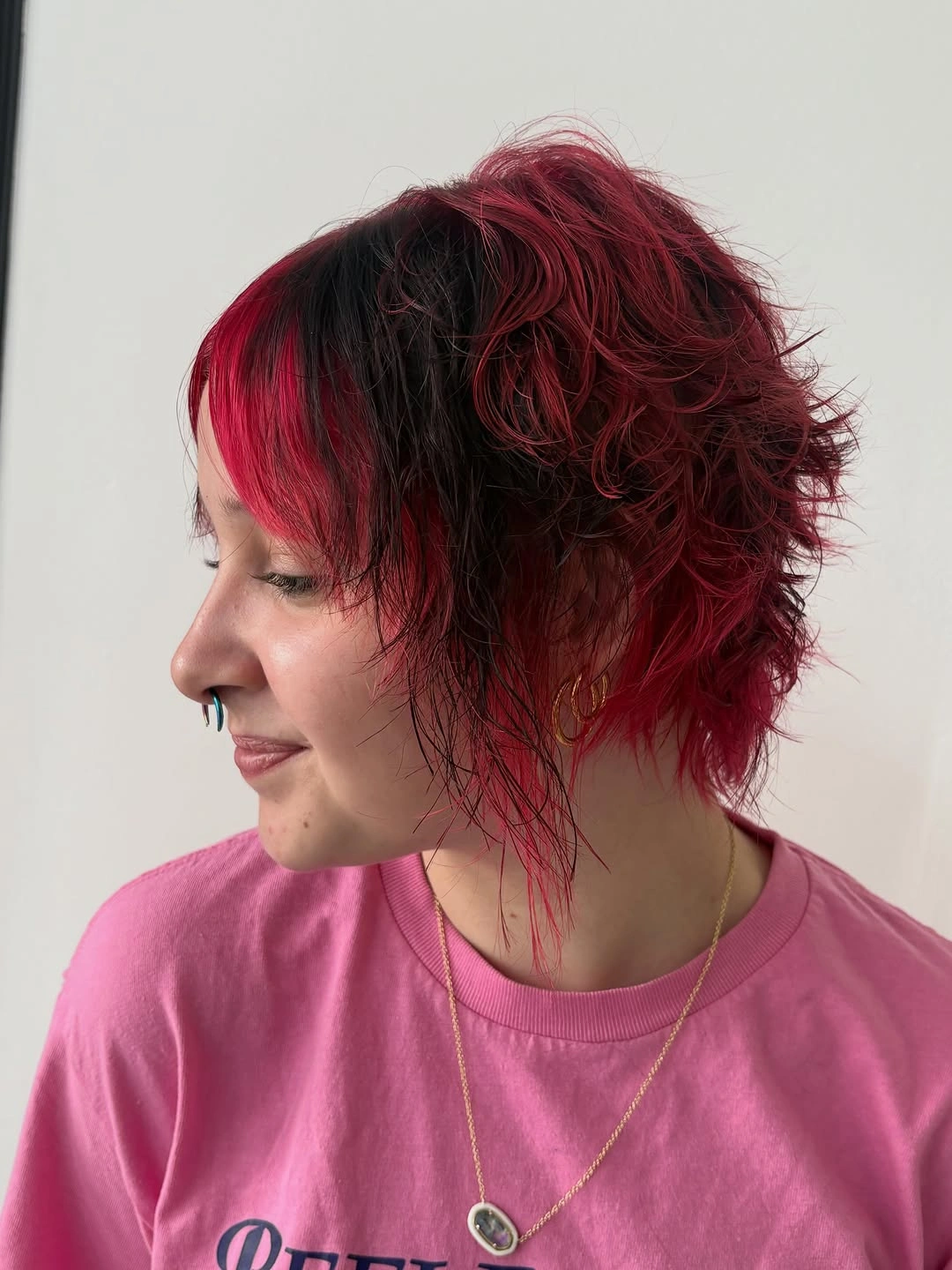 fall short haircuts 2026 Cherry Noir Textured Pixie With Electric Red Layers