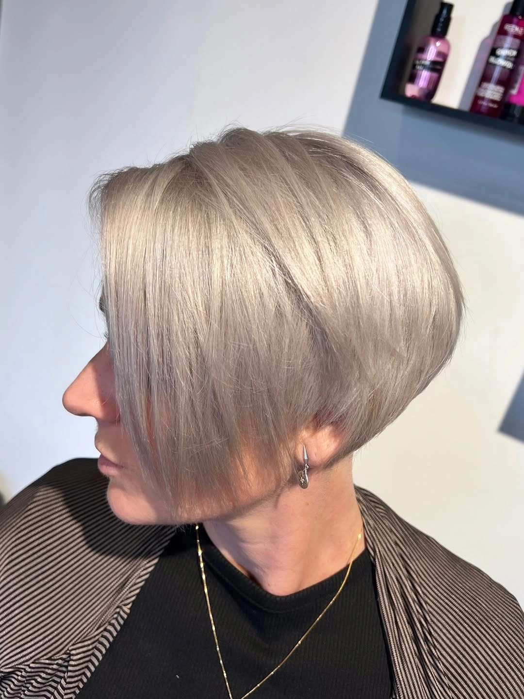 fall short haircuts 2026 Sleek Platinum Precision Bob With Long Side Fringe