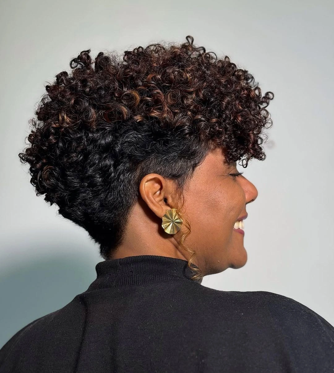 fall short haircuts 2026 Curly Taper Fade With Defined Crown Volume