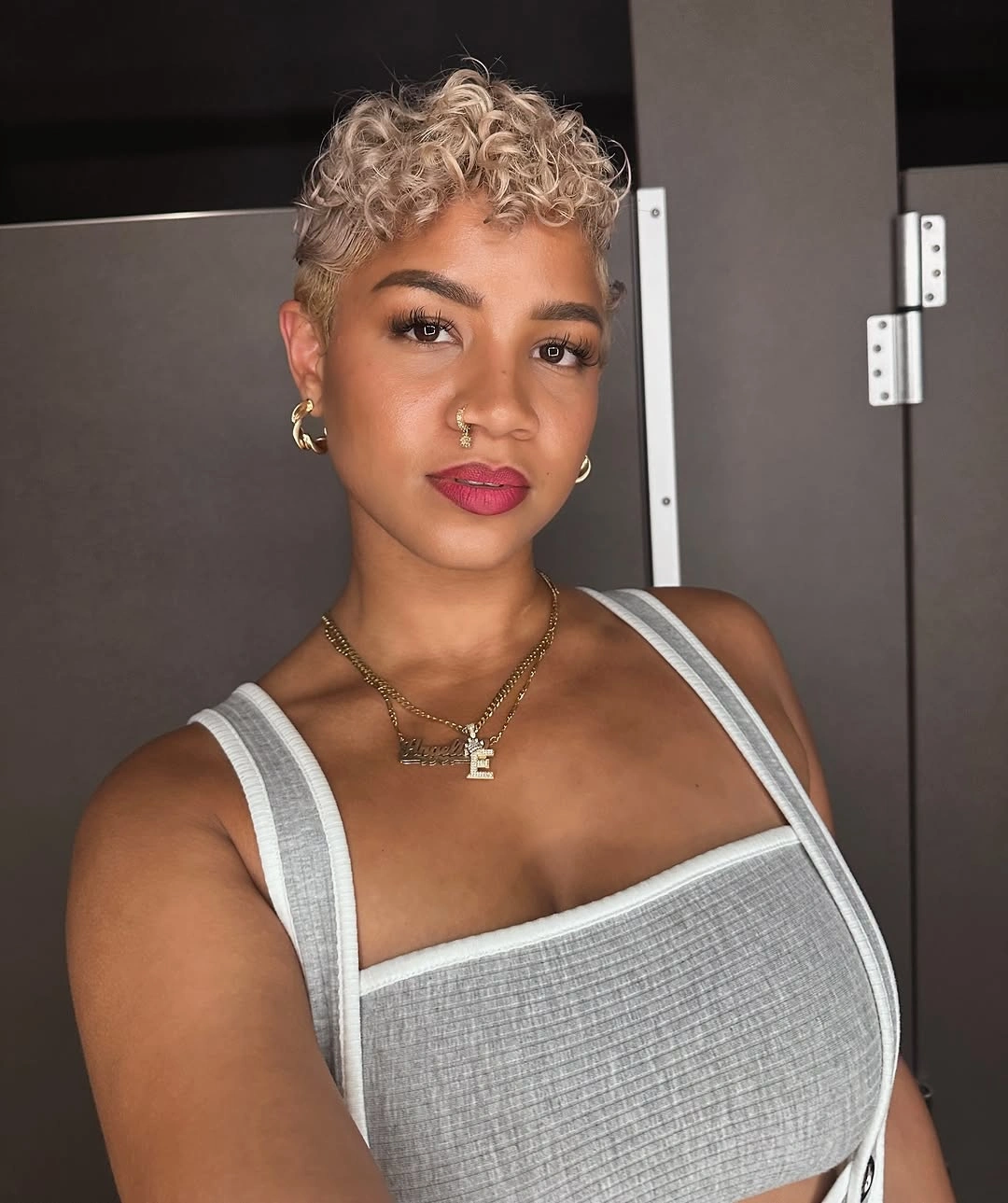 fall short haircuts 2026 Platinum Curly Pixie With Defined Texture