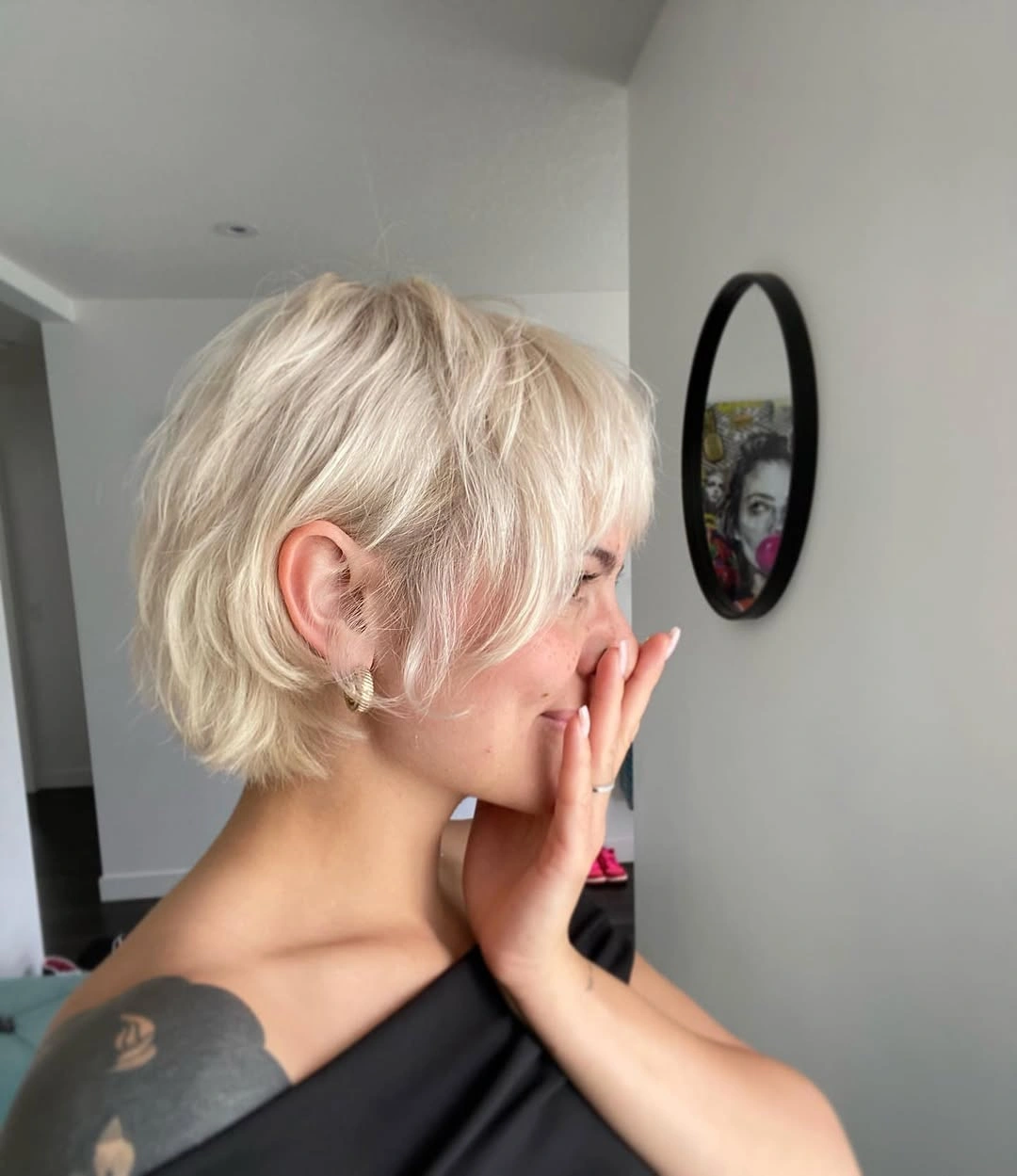 fall short haircuts 2026 Feathered Platinum Bixie With Soft Layers