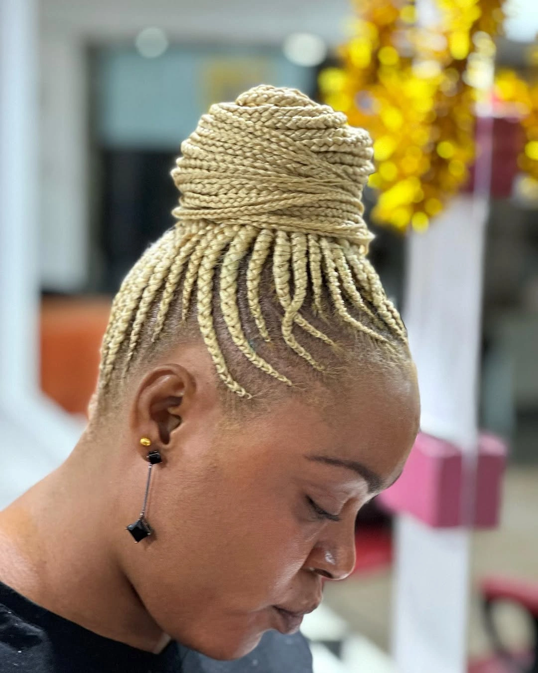 feed in braid hairstyles Blonde Feed-In Braided Bun With Modern Contrast