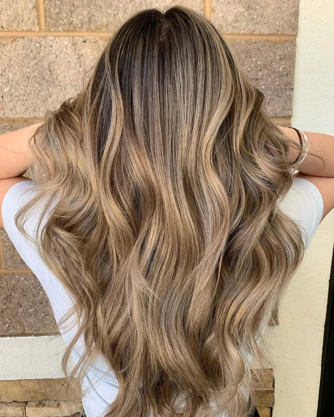 full head babylights blonde on brown hair Long Glossy Waves With Soft Golden Babylights
