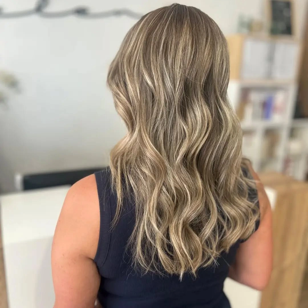 full head babylights blonde on brown hair Soft Sandy Blonde Waves With Seamless Babylight Blending