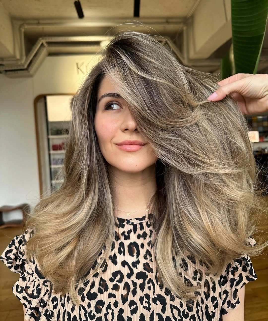 hair lowlights color ideas and inspiration Layered Blonde Waves With Darker Ribbons