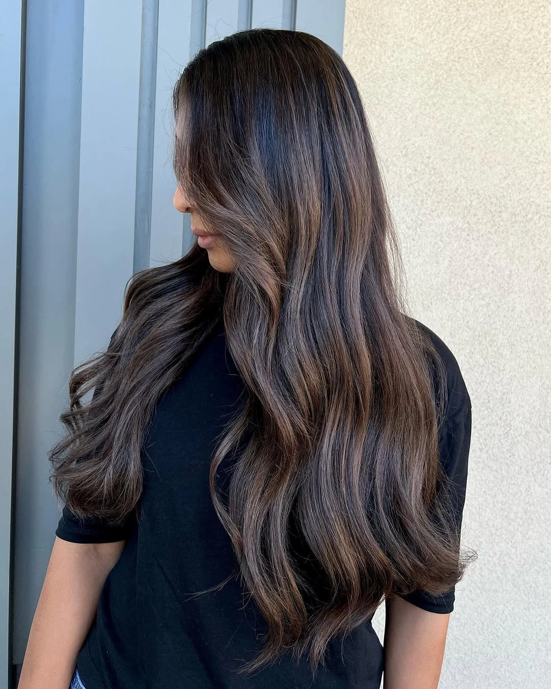 hair lowlights color ideas and inspiration Long Brunette Waves With Caramel Ribbons