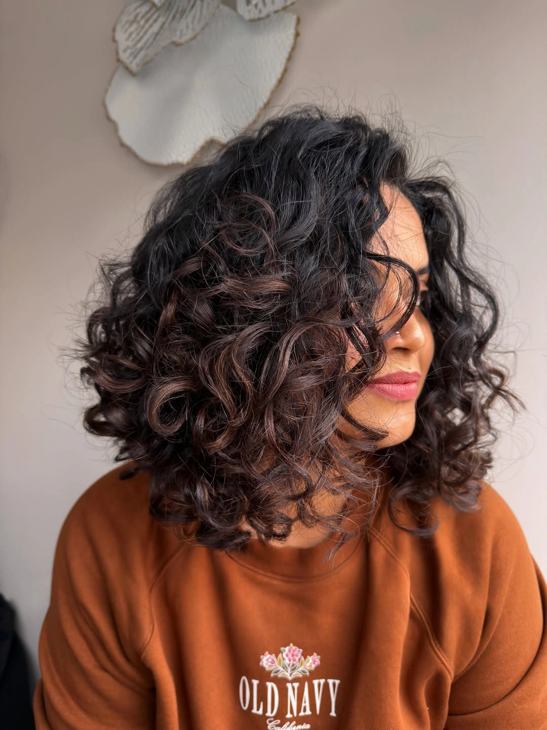 heatless curls hairstyle Rich Brunette Curls With a Soft Side Part for Everyday Elegance