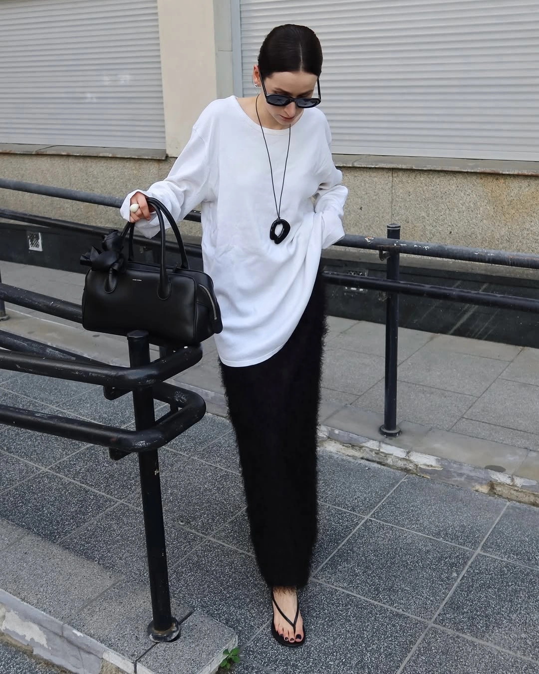 knit skirt outfits fall 2026 Minimal Black and White Knit Styling With Contemporary Texture