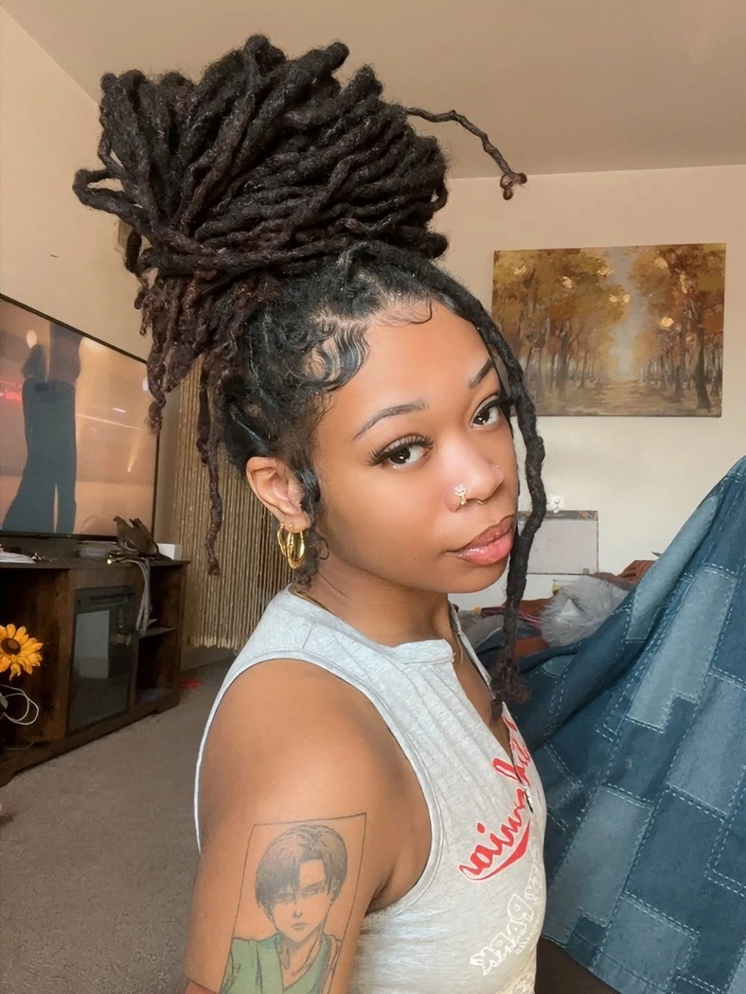 locs hairstyles for black women Oversized High Bun With Dramatic Long Locs