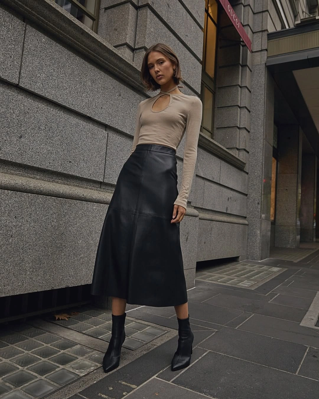 midi skirt fall outfit 2026 Black Leather Midi Skirt with Minimalist Elegance