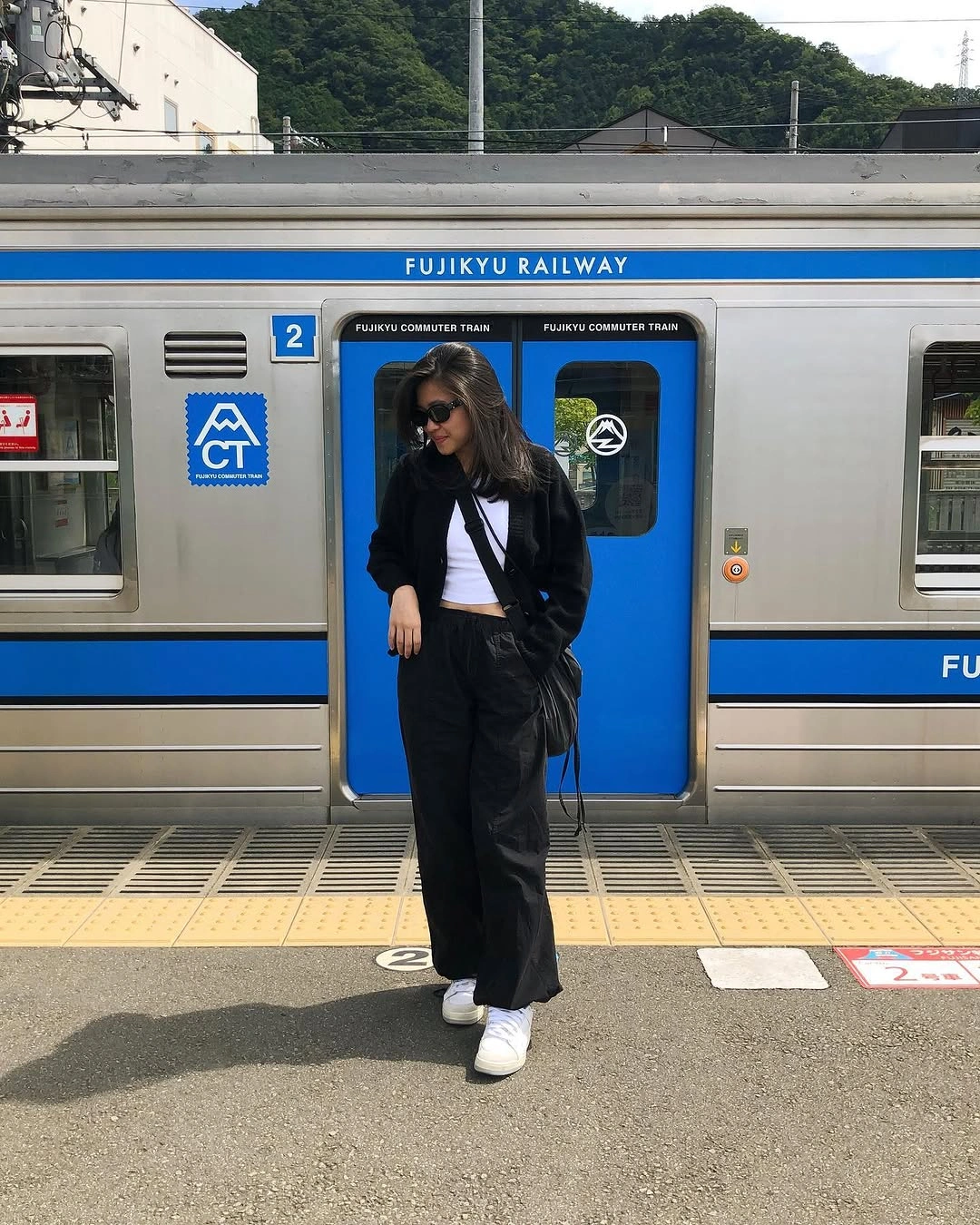 September fashion trends 2026 Black Column Dress With White Sneakers
