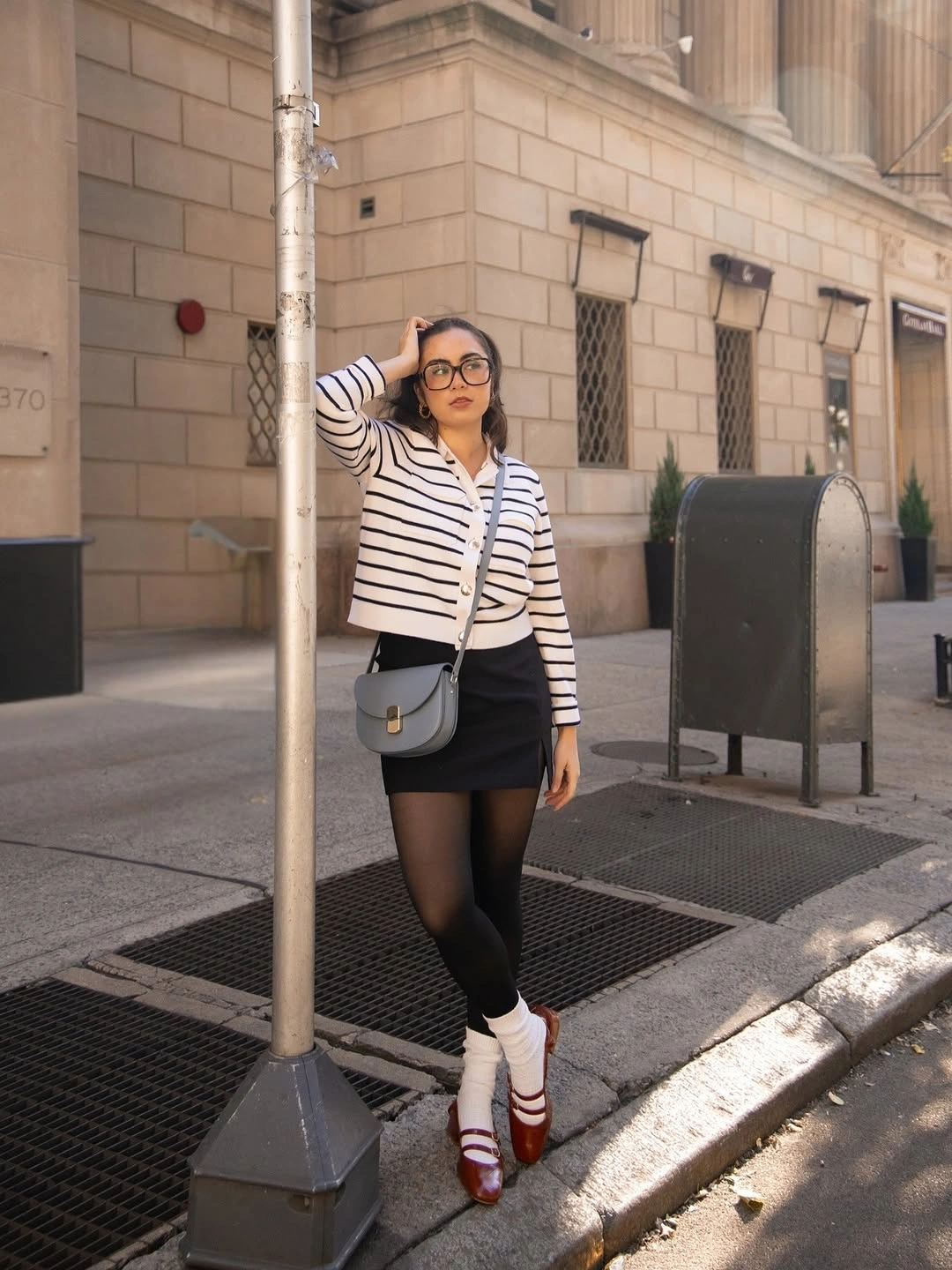 September fashion trends 2026 Striped Sweater With Black Mini Skirt