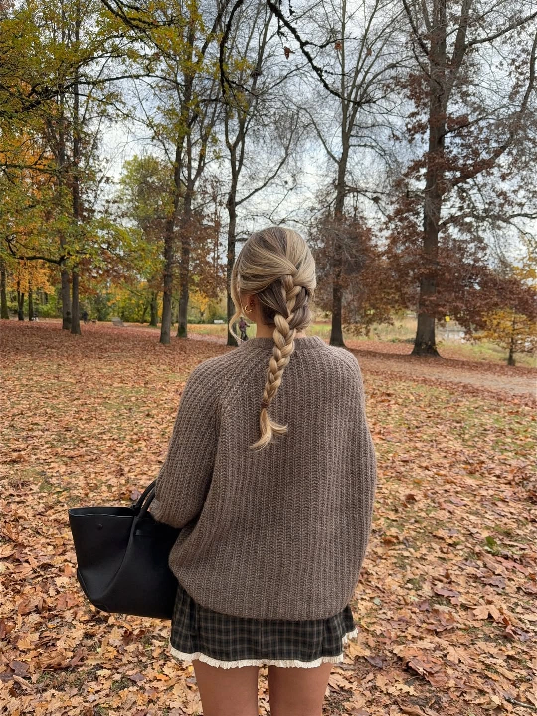 September fashion trends 2026 Oversized Knit With Mini Skirt And Loafers