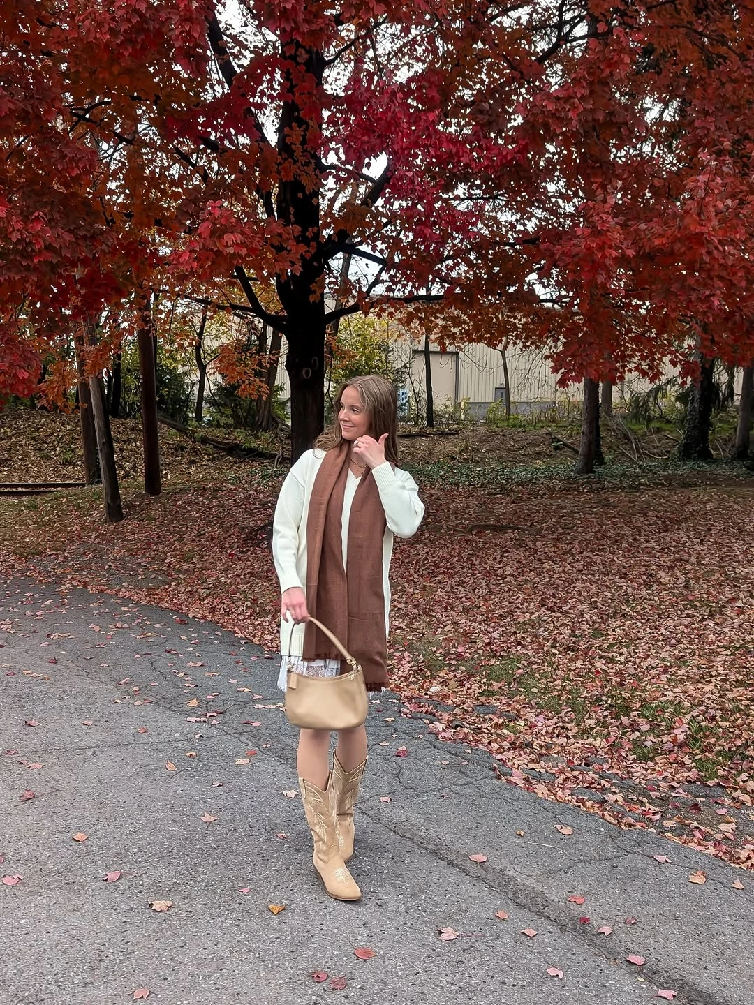 September fashion trends 2026 Long Vest With Cream Boots And Autumn Leaves