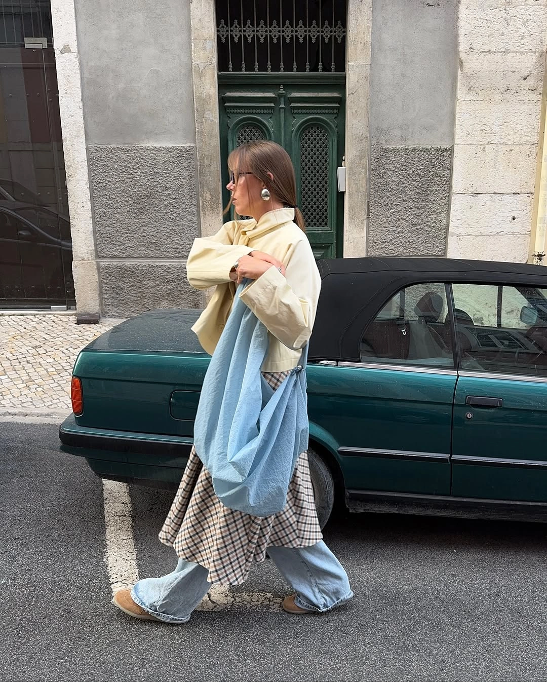 September fashion trends 2026 Pale Blue Shirt Layered Over Check Skirt