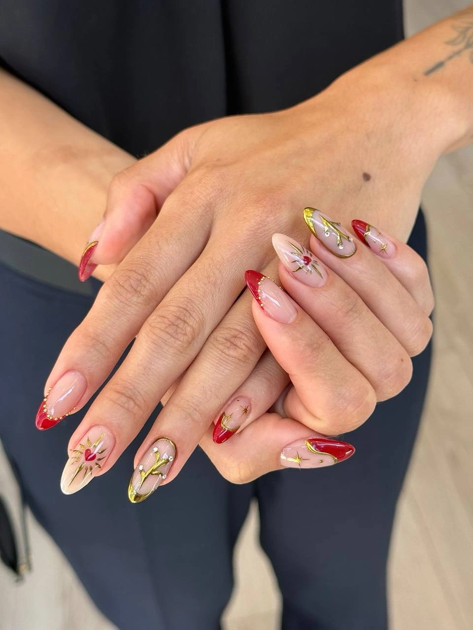 September nail art ideas 2026 Pink Nails With Gold And Floral Details