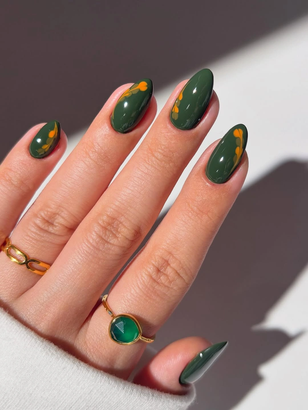 September nail art ideas 2026 Dark Green Nails With Tiny Orange Dots