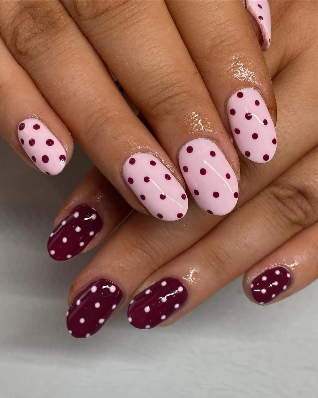 September nail art ideas 2026 Pink And Burgundy Polka Dot Short Nails