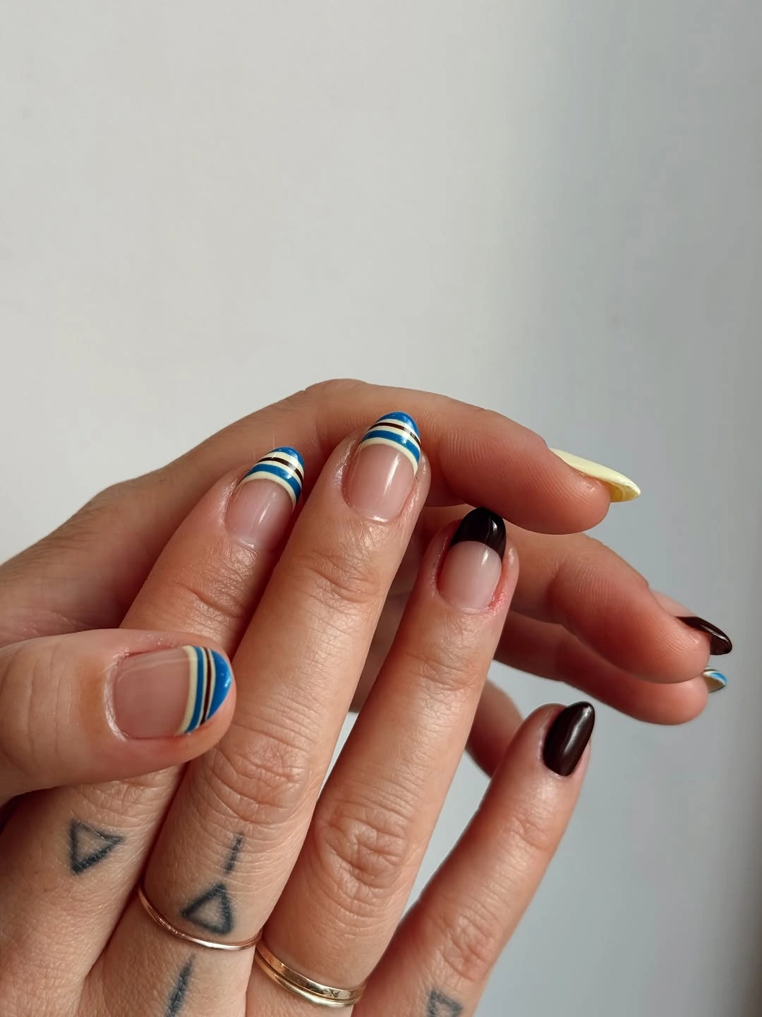 September nail art ideas 2026 Blue Striped Tips With Black Accent Nails