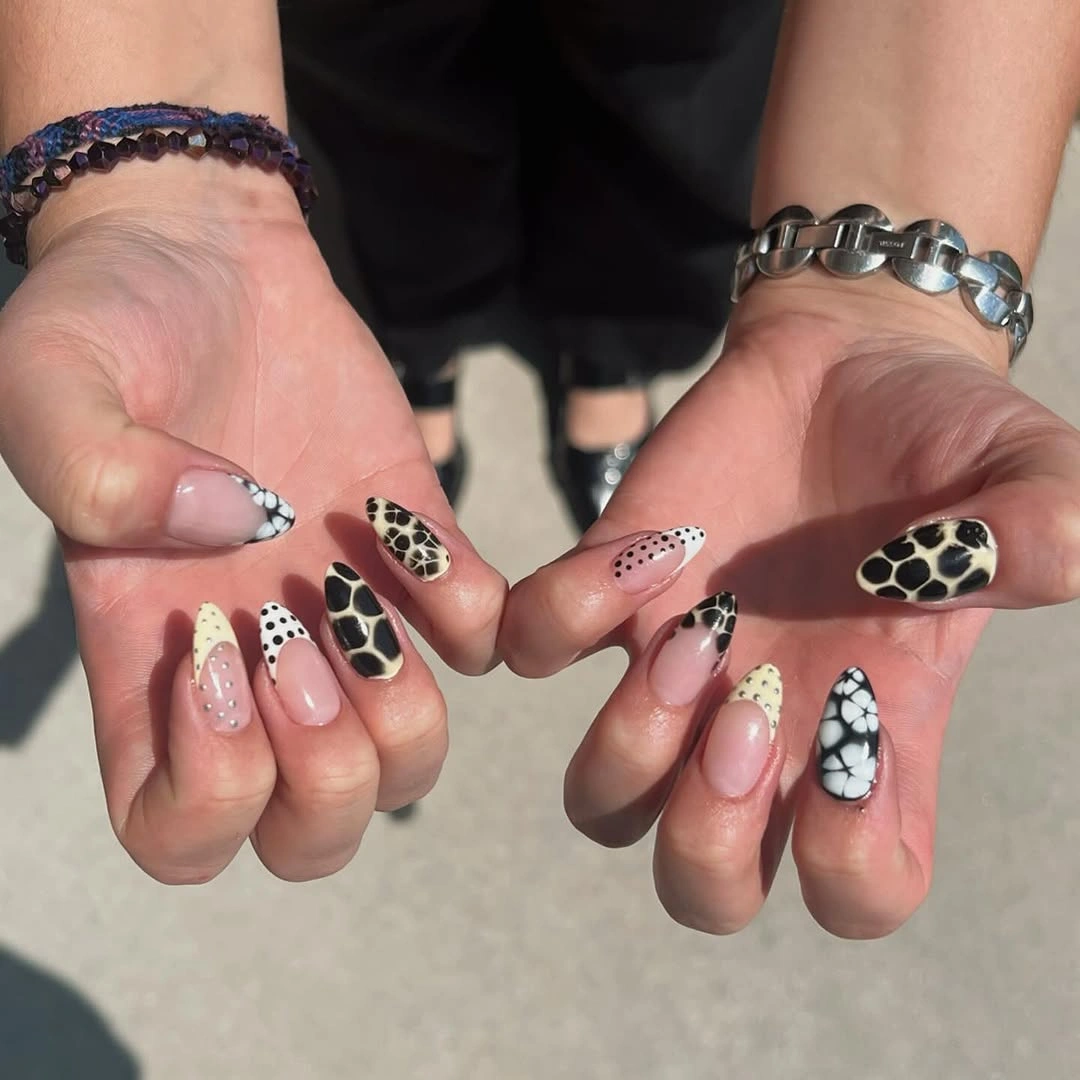 September nail art ideas 2026 Cow Print Mix With Pink Glitter