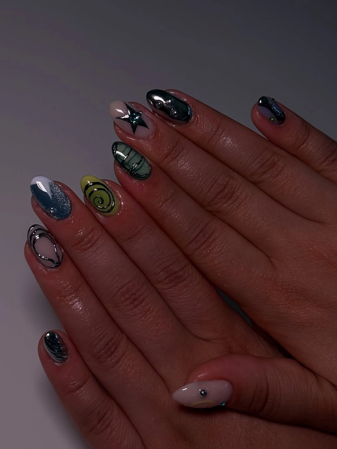 September nail art ideas 2026 Moody Mismatched Nails With Graphic Symbols