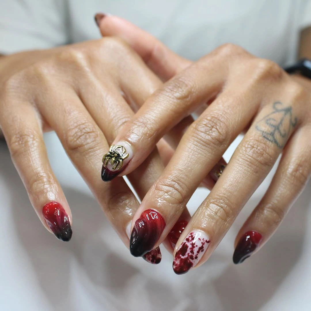 September nail designs 2026 Red And Black Gradient With Speckled Accent