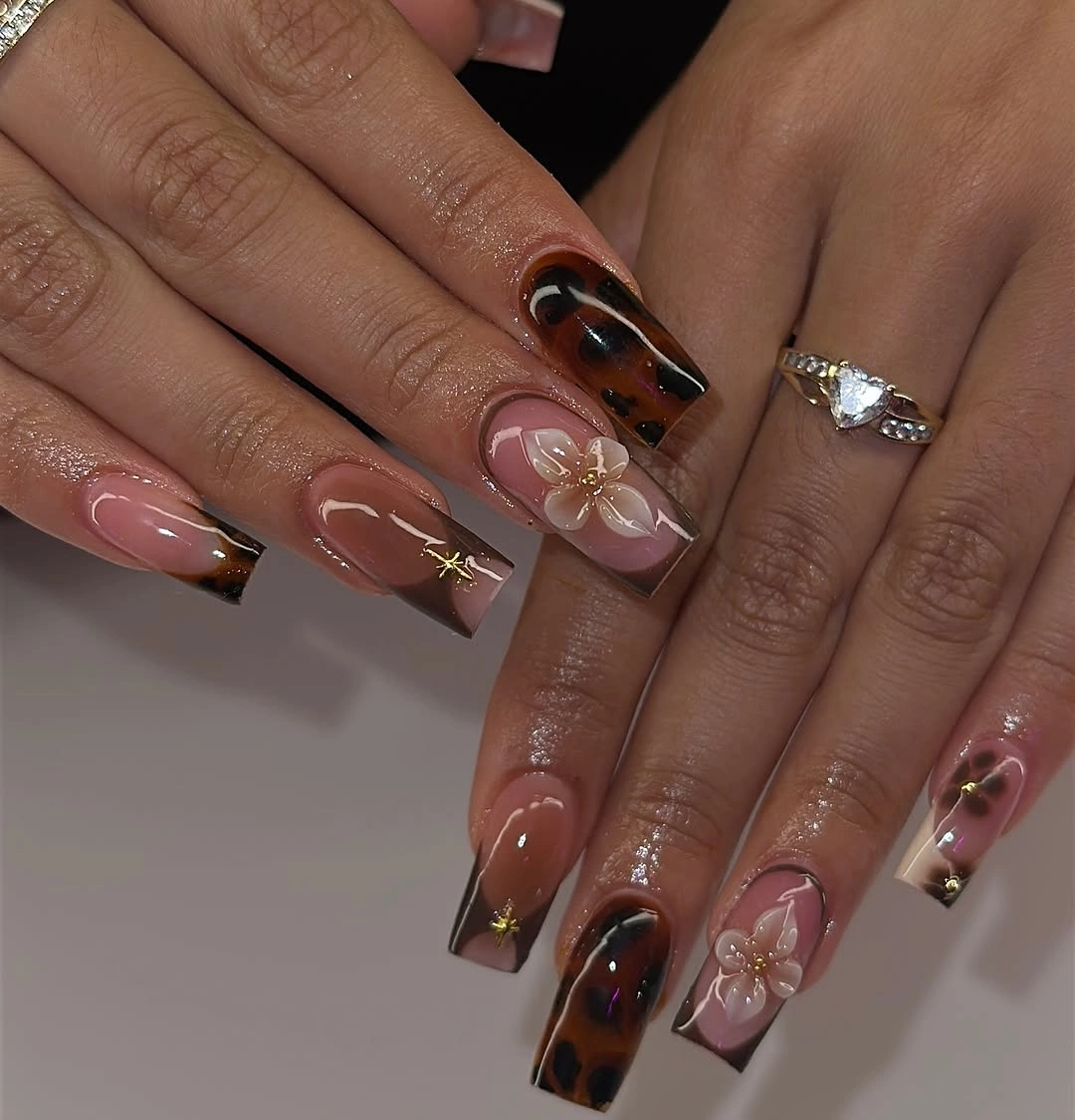 September nail designs 2026 Clear Tortoise Tips With Pink Flowers