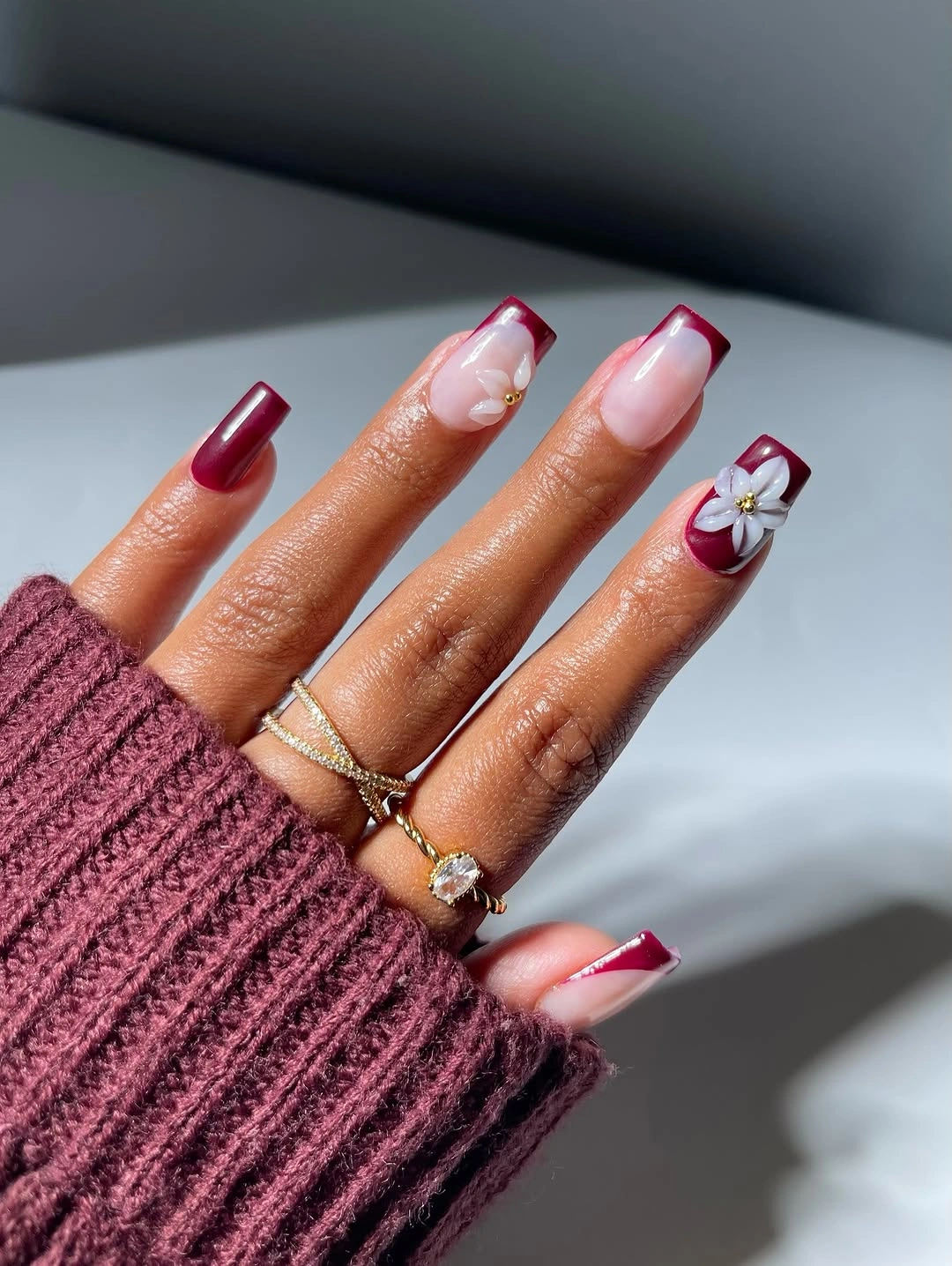 September nails color 2026 Burgundy French Tips With White Floral Accents