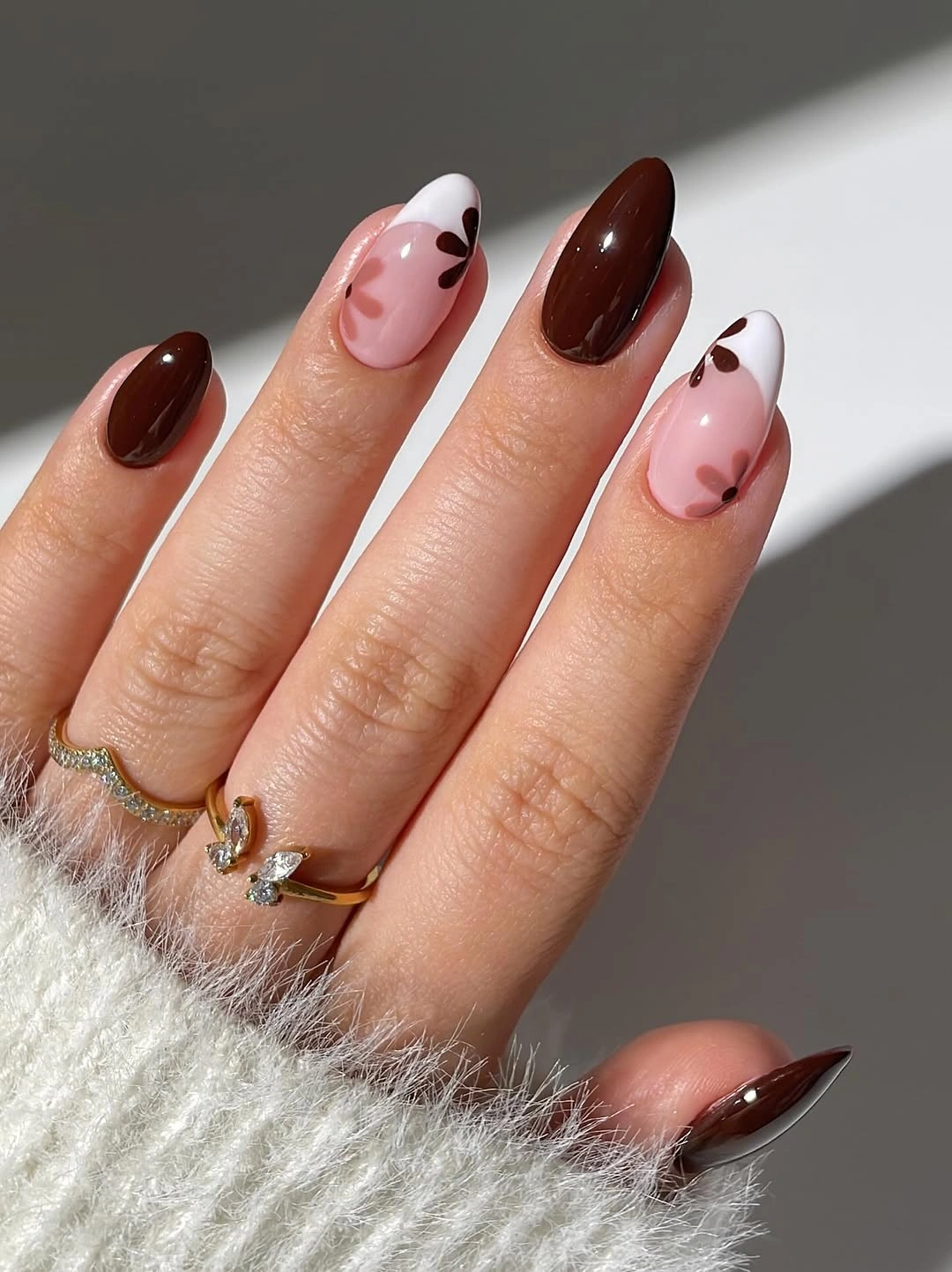 September nails color 2026 Deep Brown Almonds With Soft Floral Nails