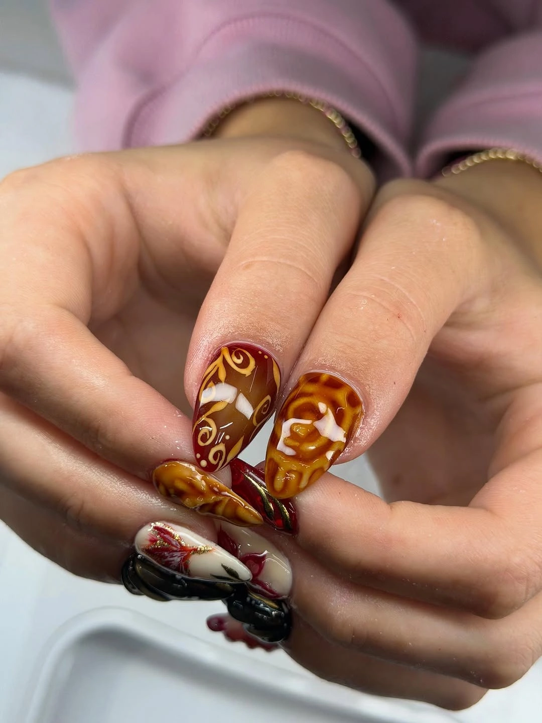 September nails color 2026 Caramel Swirls With Burgundy Fall Details