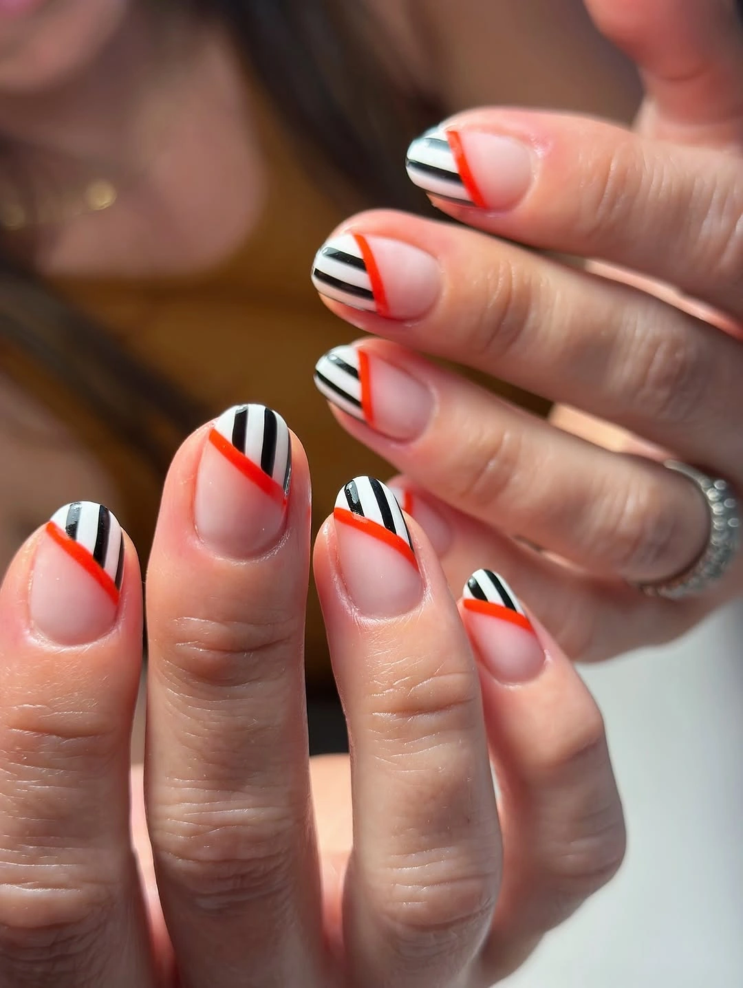 September nails color 2026 Orange And Black Striped French Tips