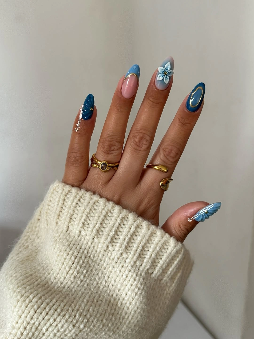 September nails color 2026 Blue Floral Accents On Nude Almond Nails
