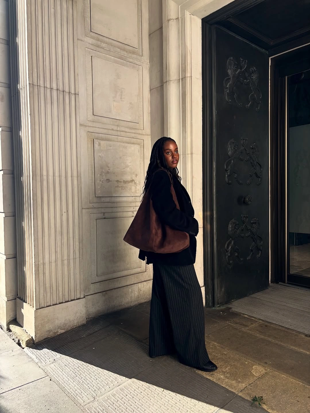 September outfits ideas 2026 Black Long Coat With Flowing Dark Skirt