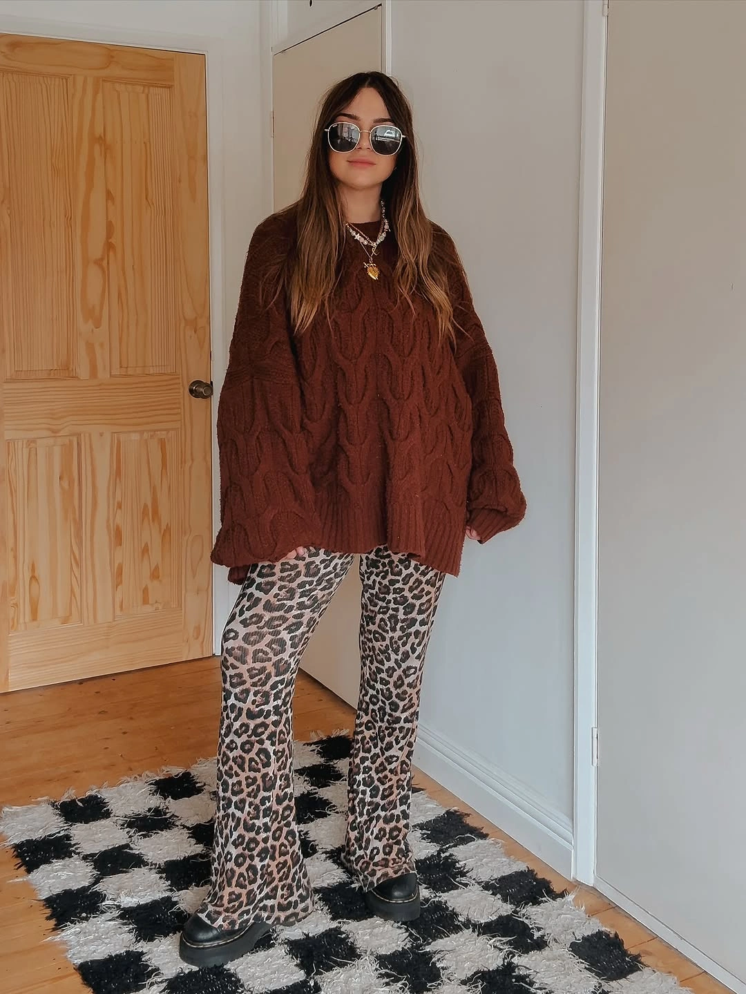 September outfits ideas 2026 Rust Cable Sweater With Leopard Trousers