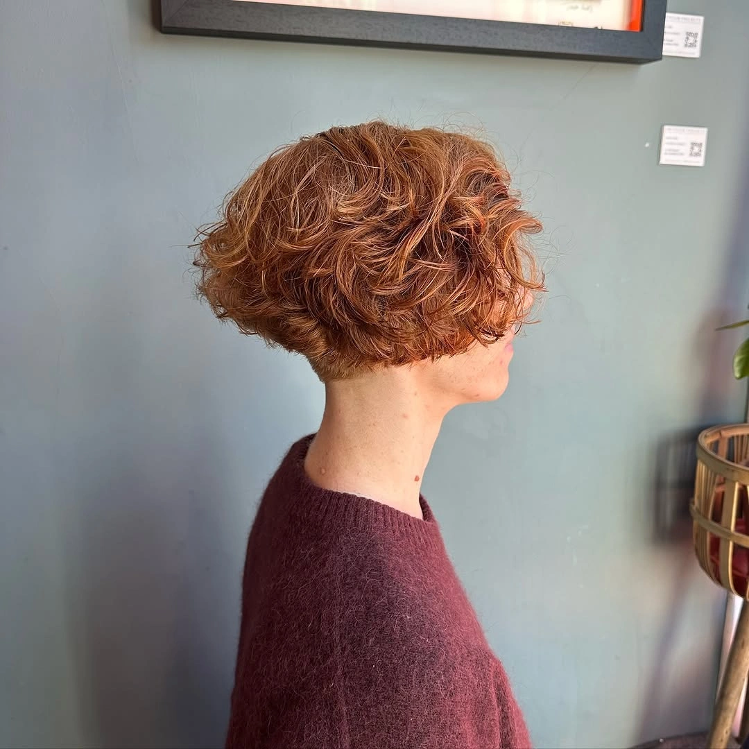 short bobbed hairstyle Voluminous Curly Pixie Bob with Soft Layers
