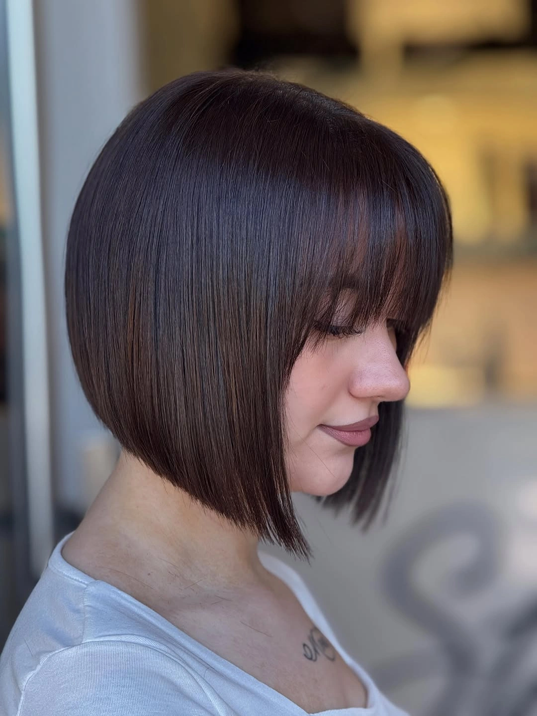 short bobbed hairstyle Glossy Precision Bob with Full Soft Bangs