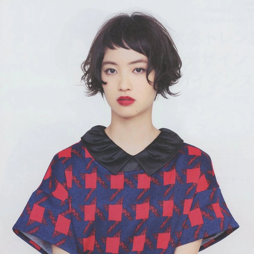 short bobbed hairstyle Playful Curly Bob Inspired by Vintage Parisian Style