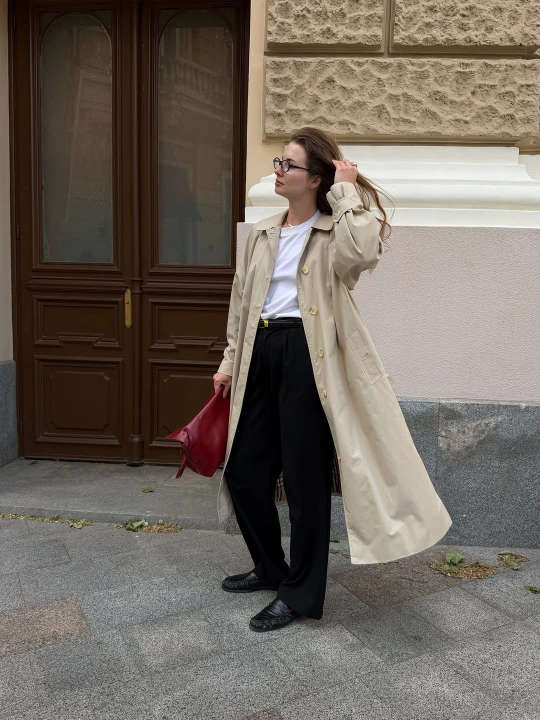 Trench coat fall outfits 2026 Classic Long Trench with Black Trousers and a Bold Red Accent