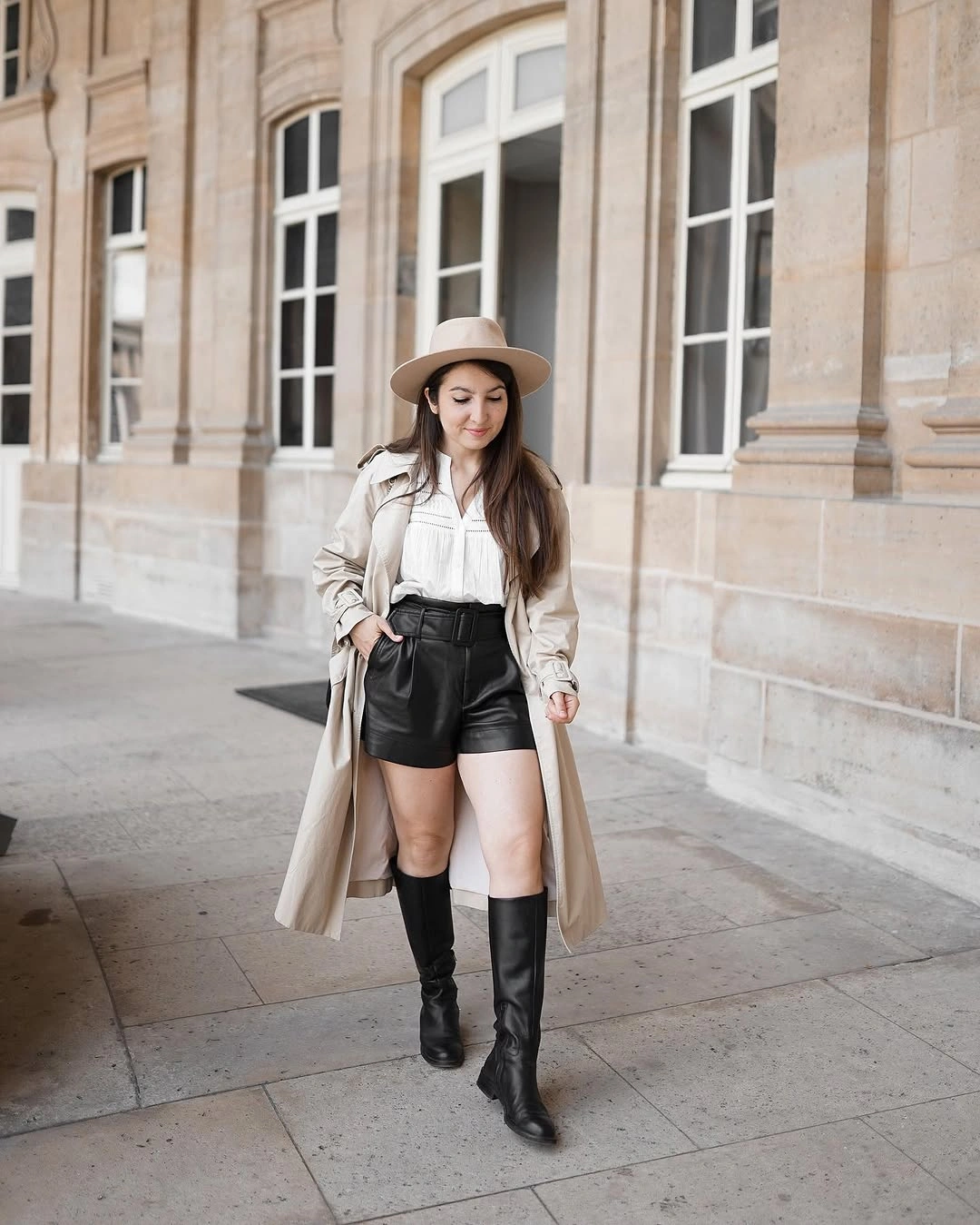 Trench coat fall outfits 2026 Tan Trench with Leather Shorts for a Modern Feminine Contrast
