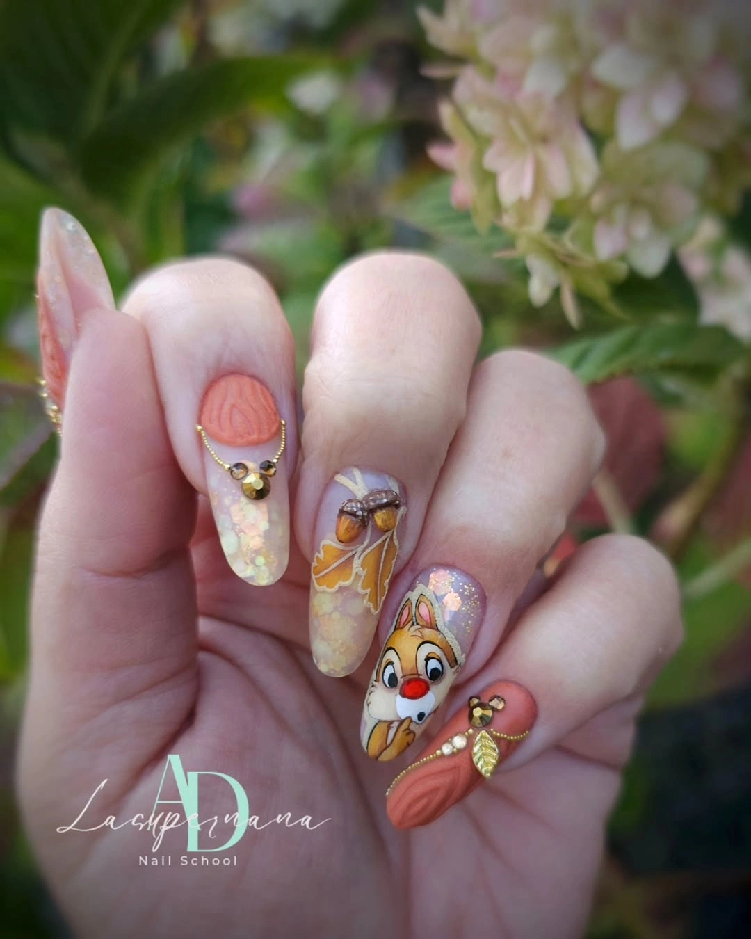 medium almond nails with colorful illustrated floral accents