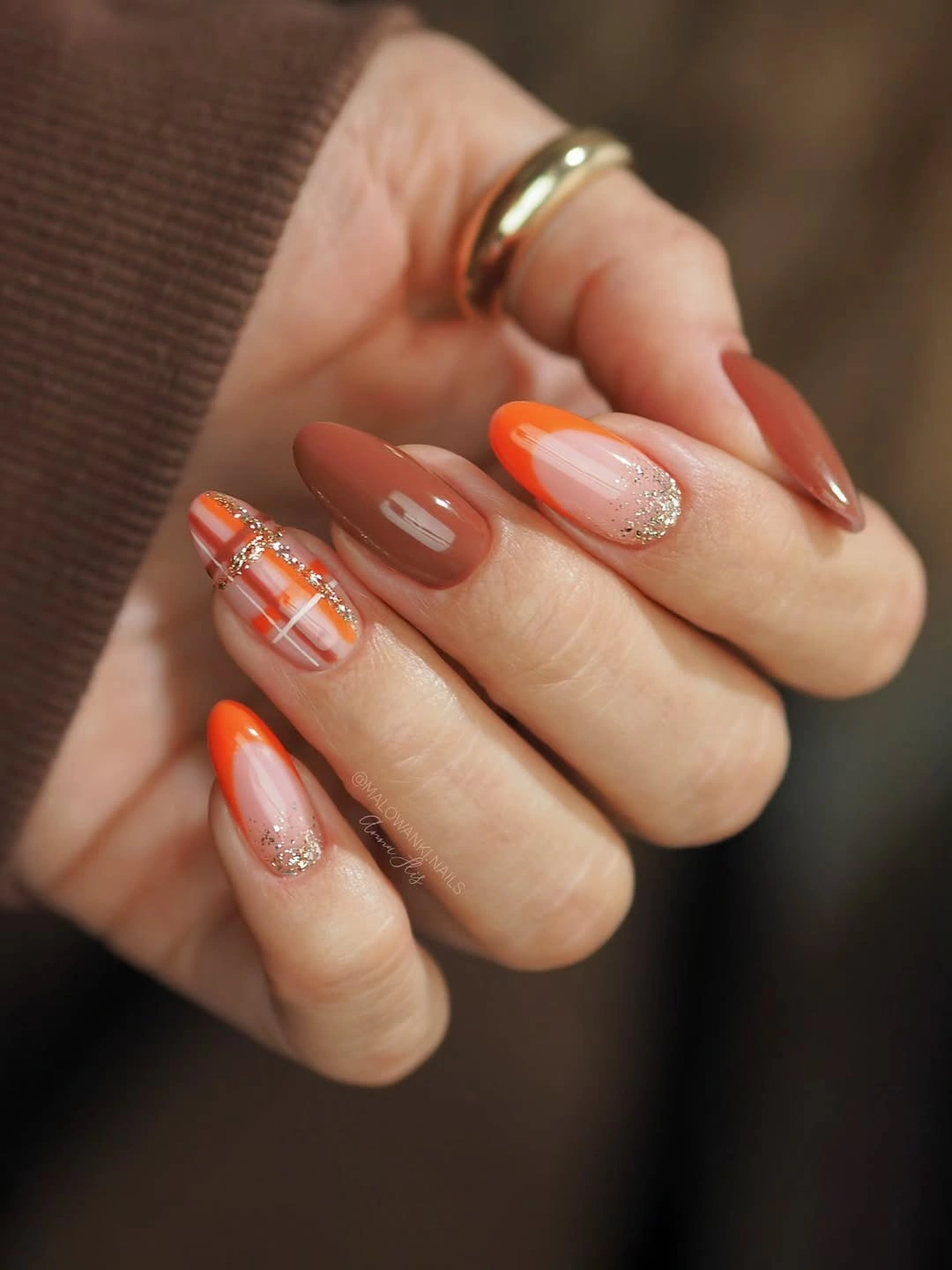 medium almond terracotta nude nails with orange details