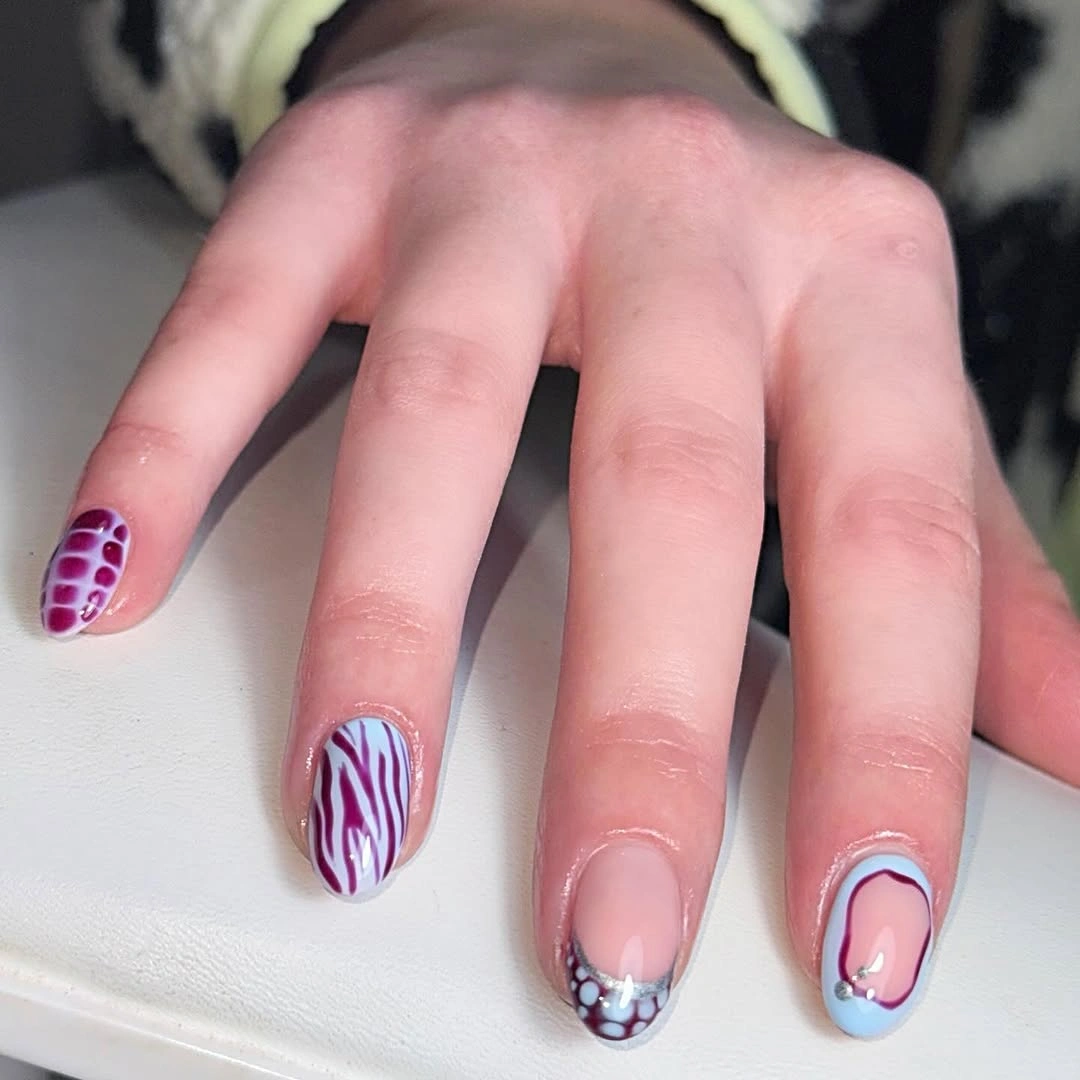 medium square pink nails with blue and white linework