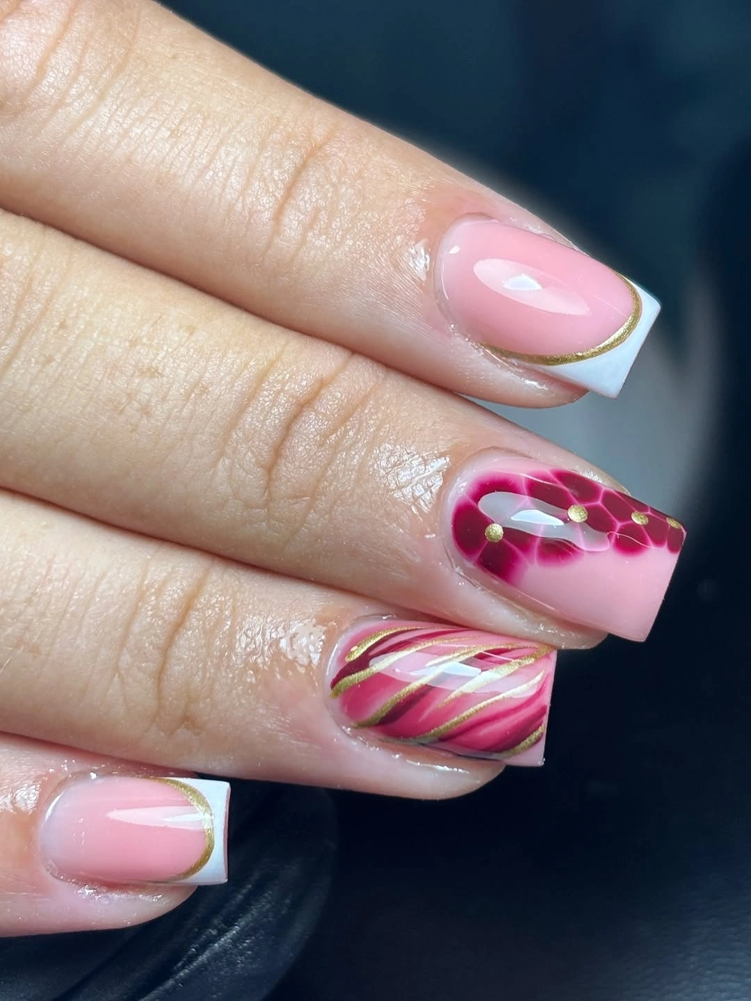 long square pink French nails with colorful swirl art