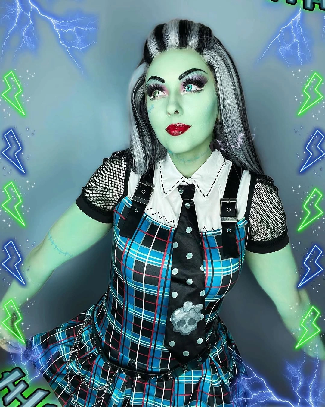 Blue and black checked dress with white collar and harness straps