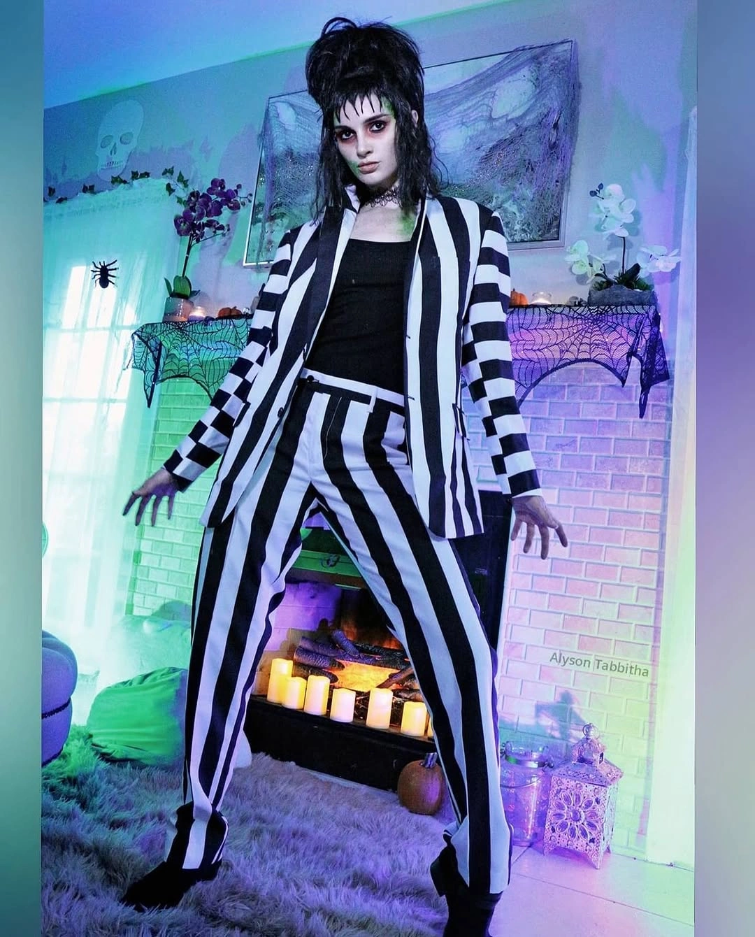 Black and white striped suit over cropped black top