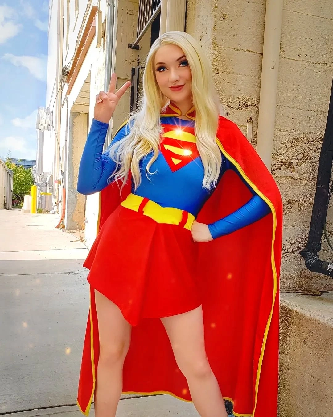 Blue and red cape costume with yellow belt and short skirt